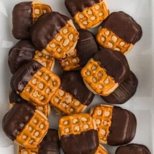 An overhead image of pretzel bites on a white plate.