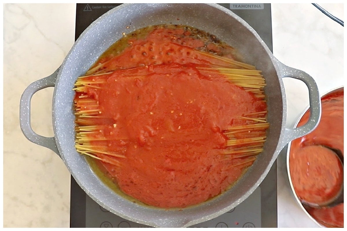 Tomato sauce poured over pasta.