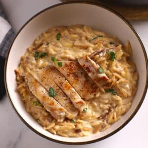 An overhead image of a bowl of chicken orzo.