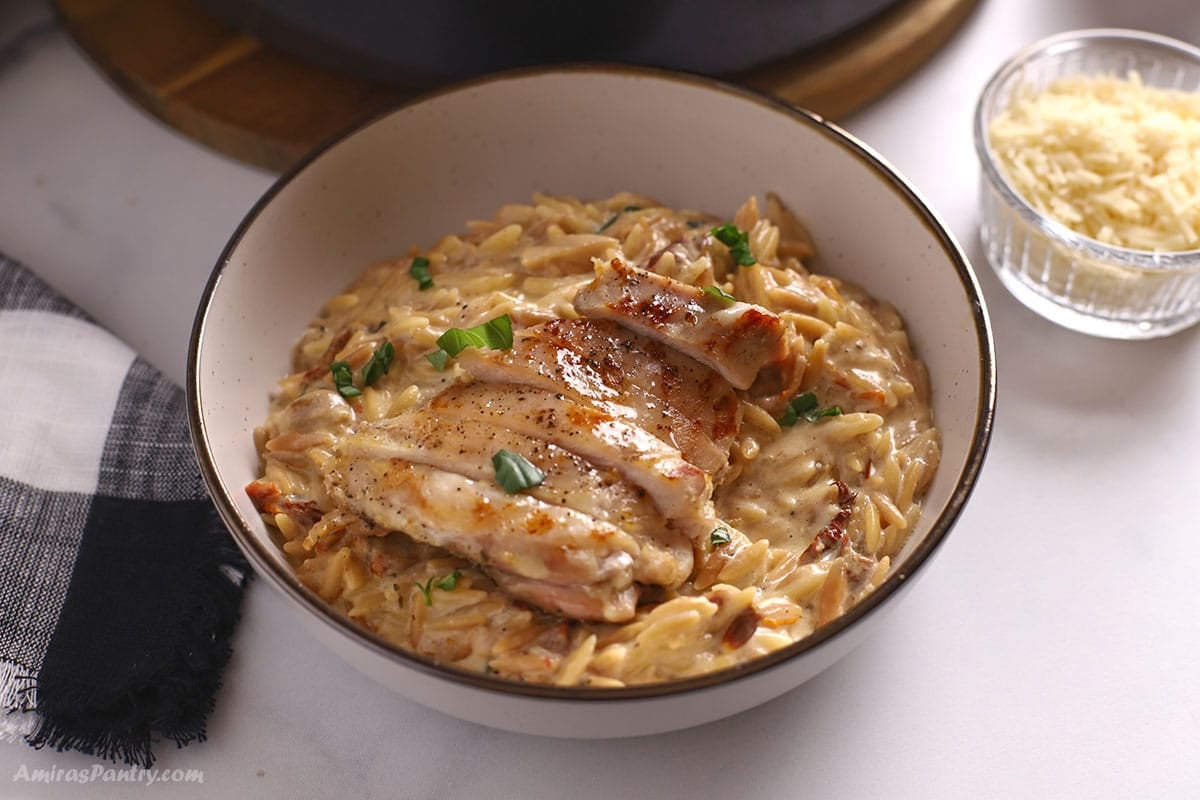 A close up image on a plate with Tuscan orzo.