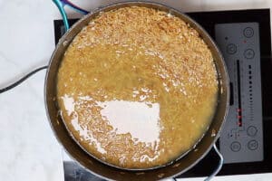 Cooking roasted orzo in a non stick skillet.