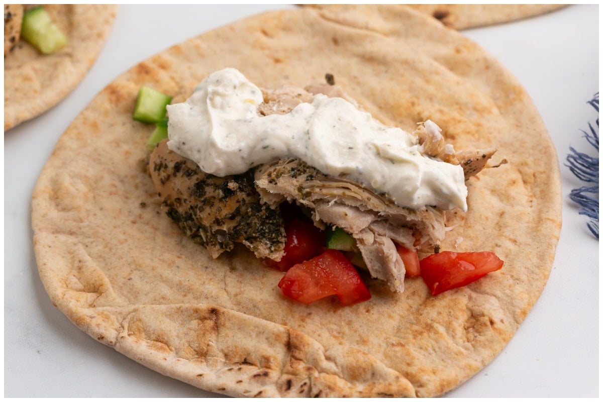 Pita bread topped with chicken gyros.