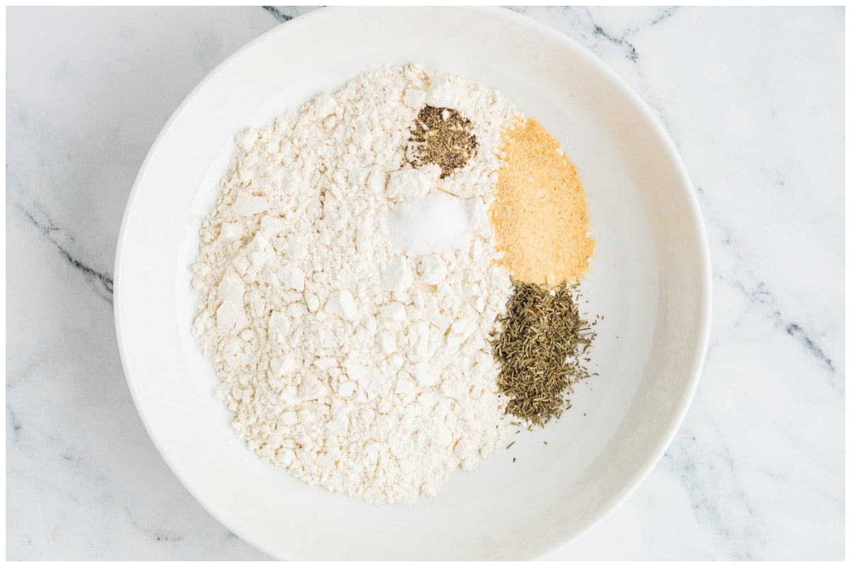 A white bowl with spice and flour mixture.