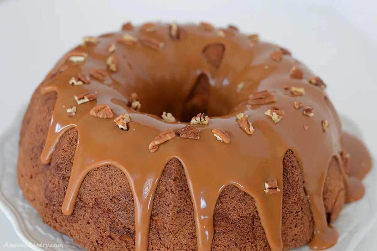 Apple cream cheese bundt cake on a serving platter.