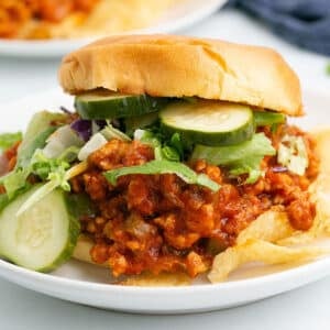 Chicken sloppy Joes sandwiche with cucumber and lettuce.