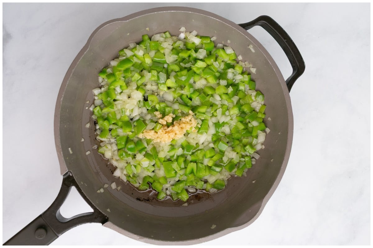 Adding garlic to the skillet.