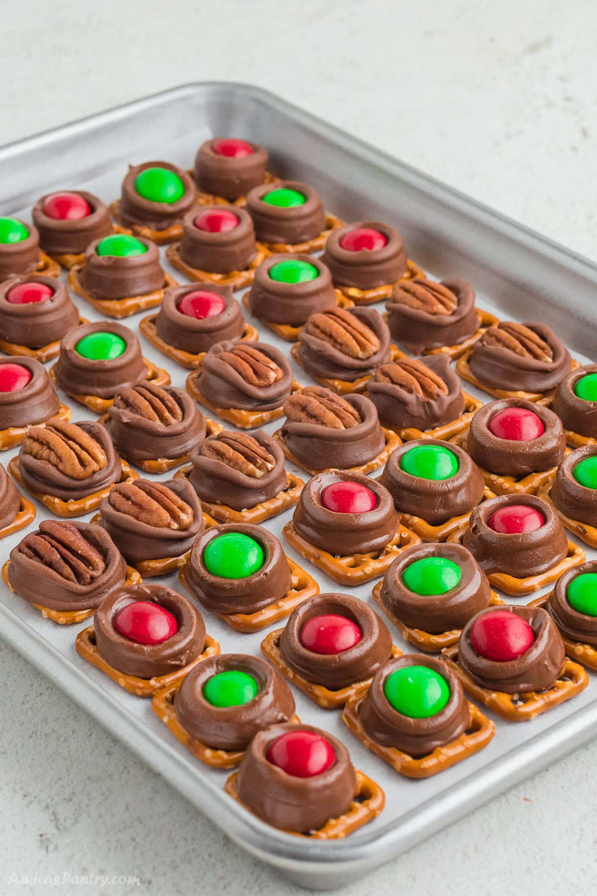 Rolo pretzel bites on a baking sheet.