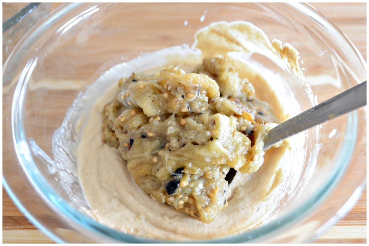 A bowl with baba ganoush ingredients.