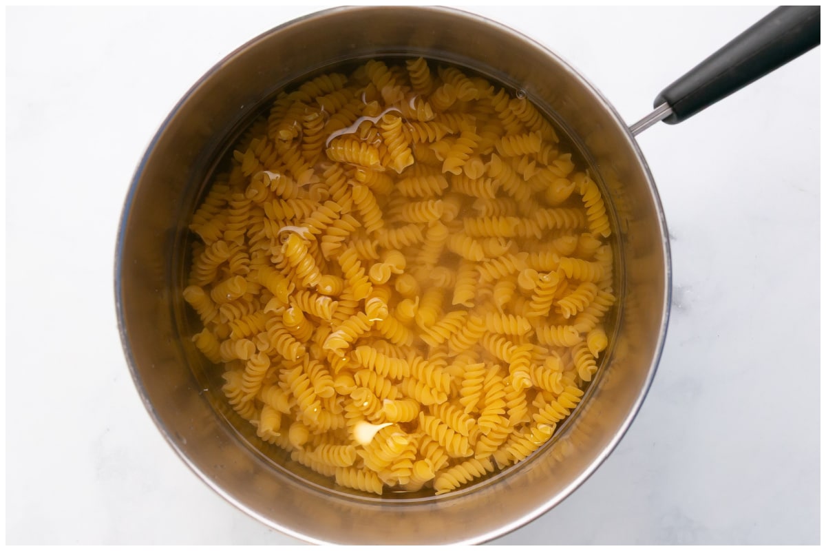 Cooking pasta in a pot with water.