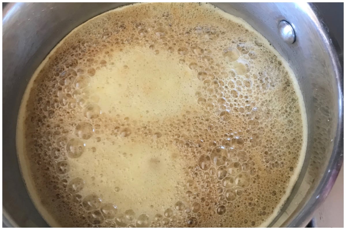 Foamy broth in the pan.