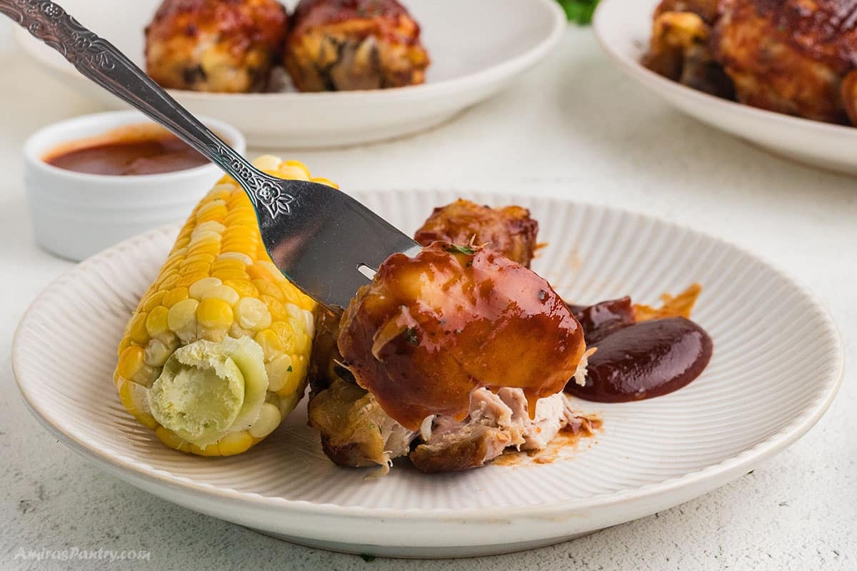 Chicken Drumstick in a plate with corn.