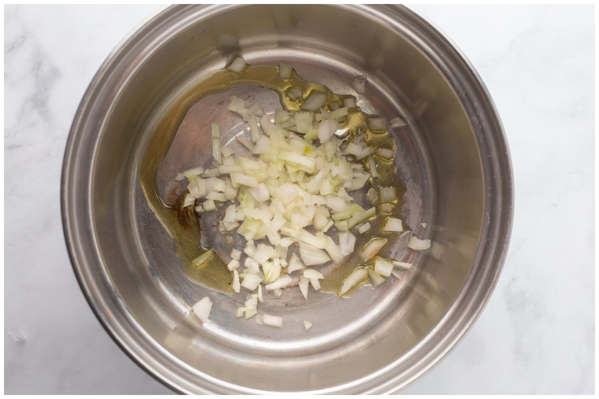 A pot with onions and oil.