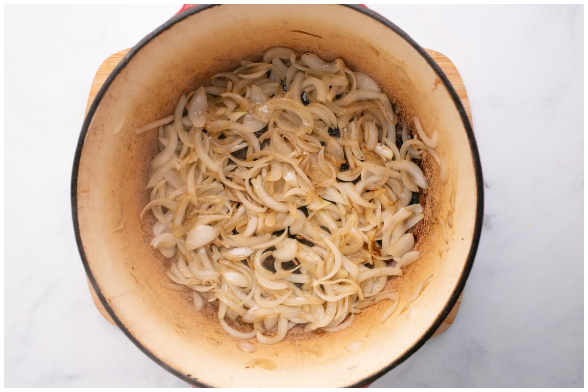 onion rings sauteed in a pot.