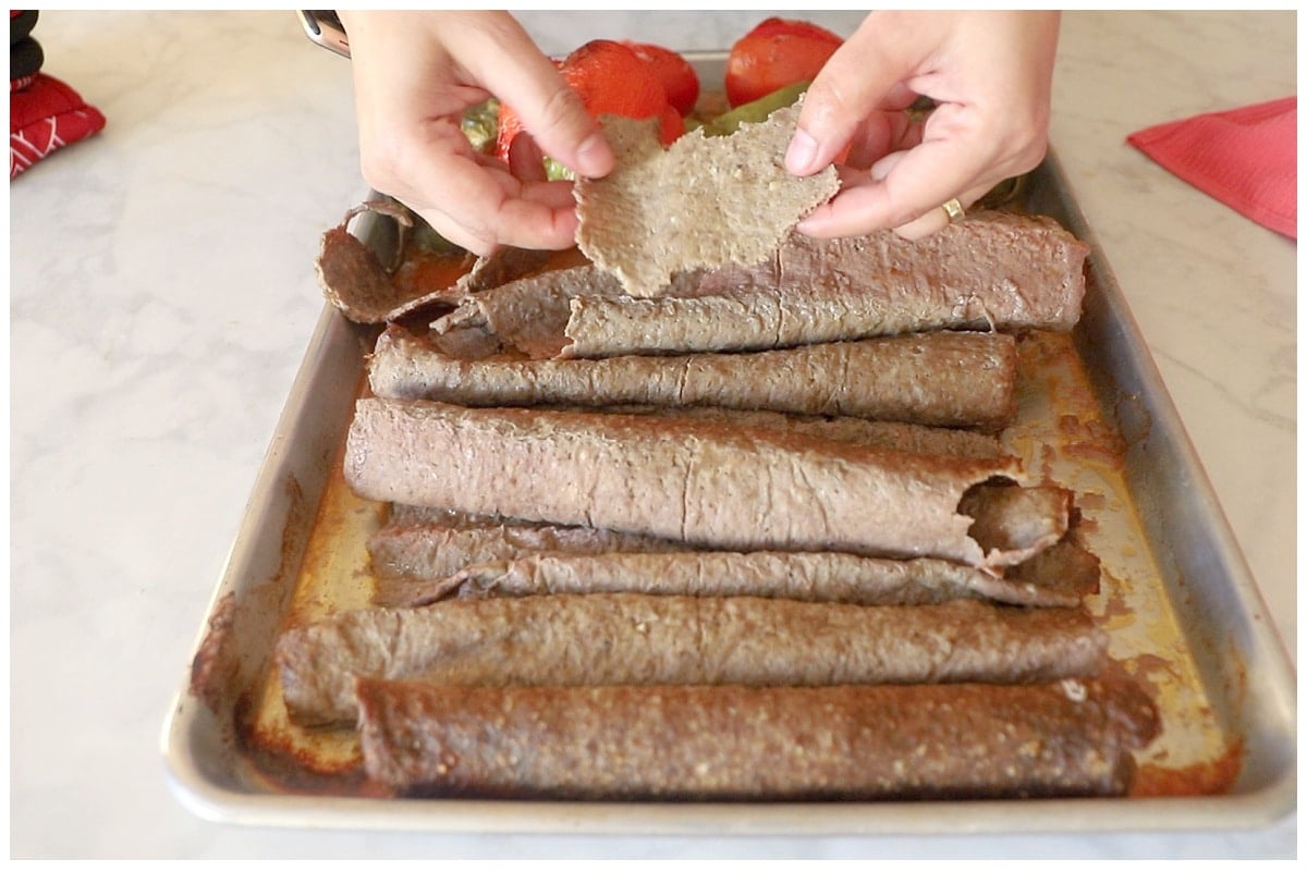 Cutting doner kebab into small pieces.