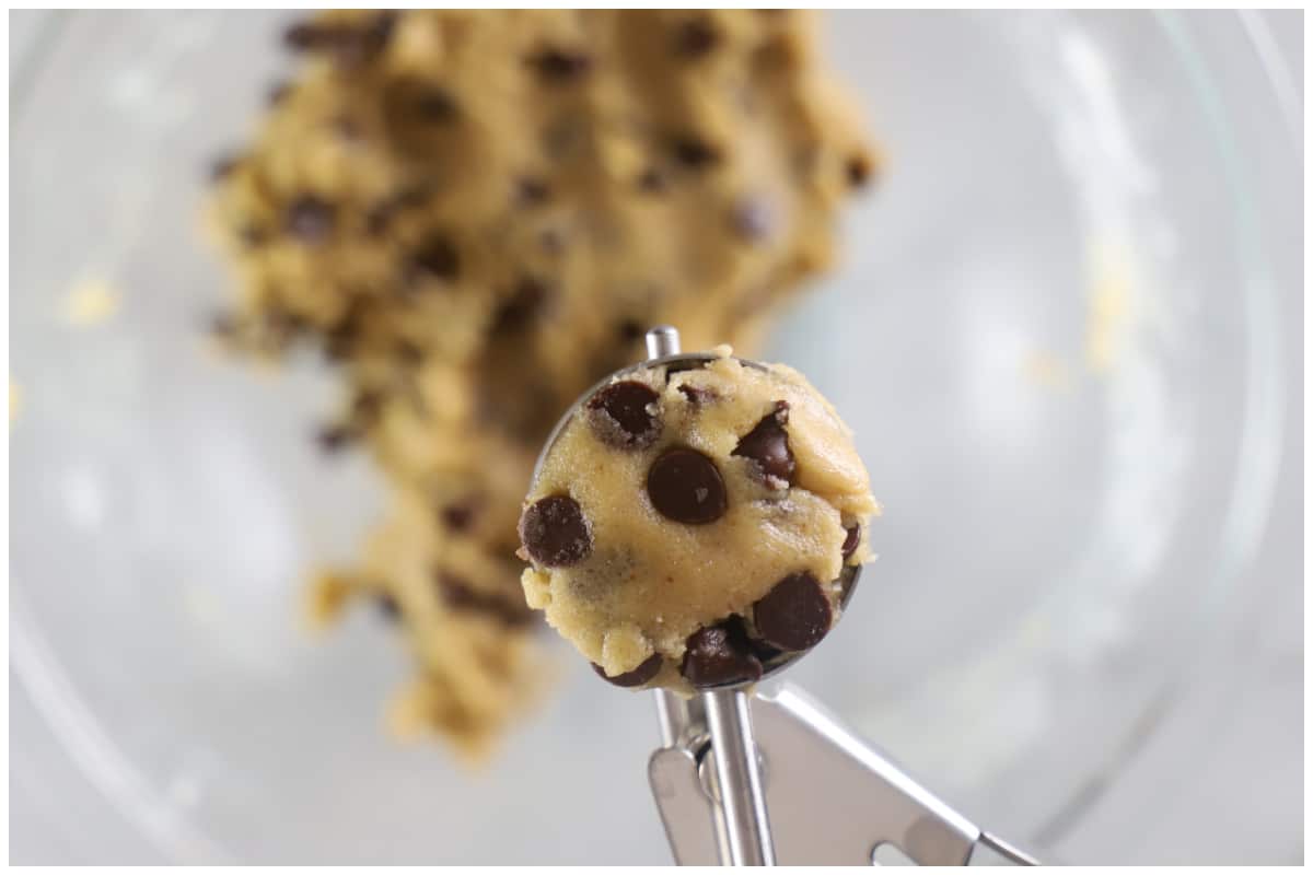 A cookies scoop with chocolate chip tahini cookie dough.