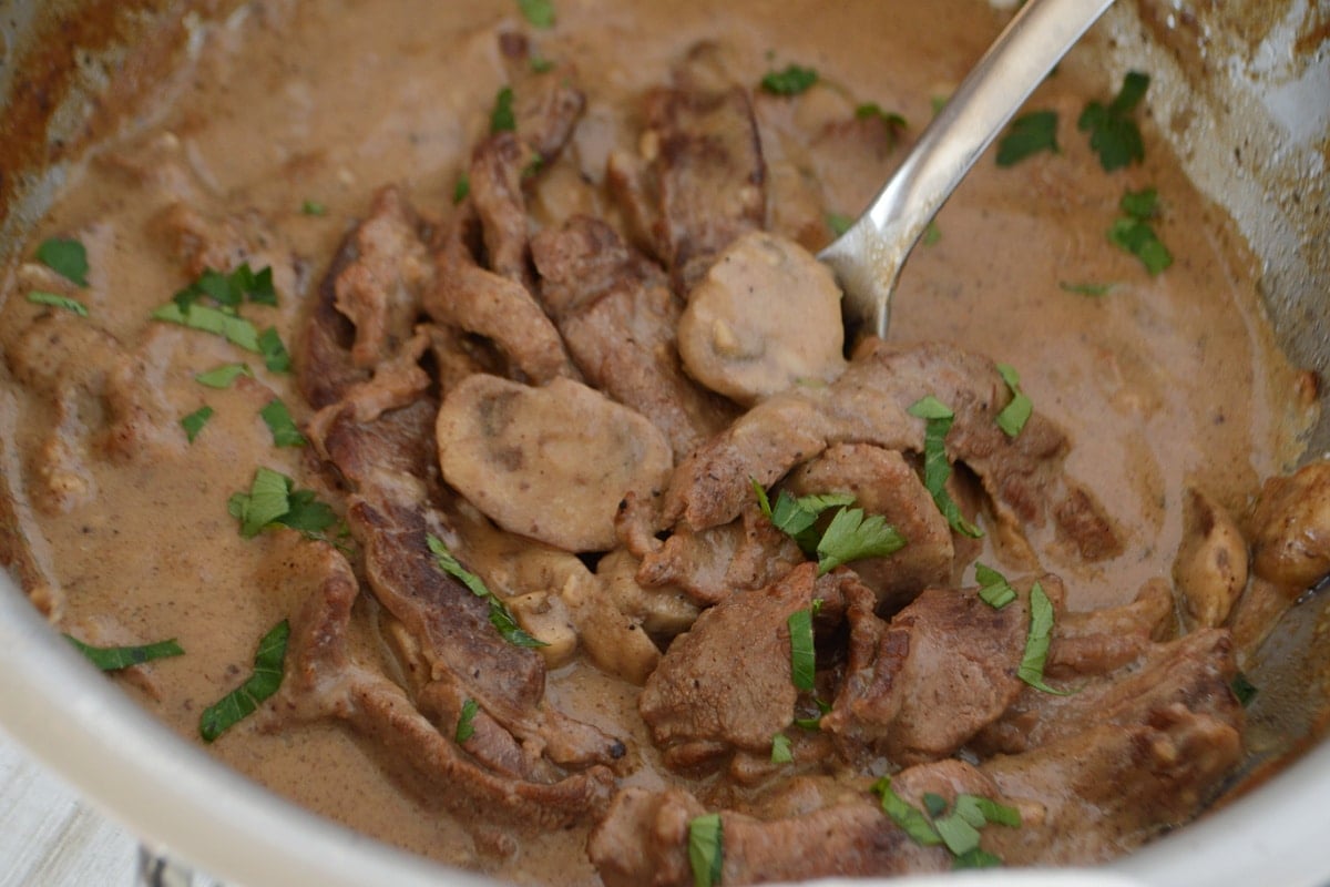 A large skillet with creamy beef stroganoff.