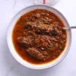 An overhead image of a large bowl with spinach stew.