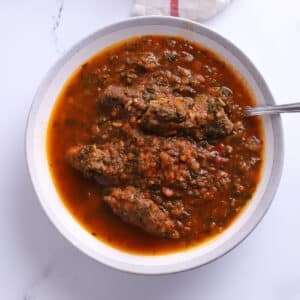 An overhead image of a large bowl with spinach stew.