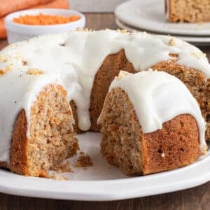 Carrot Bundt cake sliced on a serving platter.