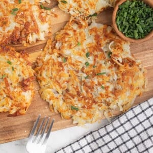 Potato Rosti stack on a wooden board.