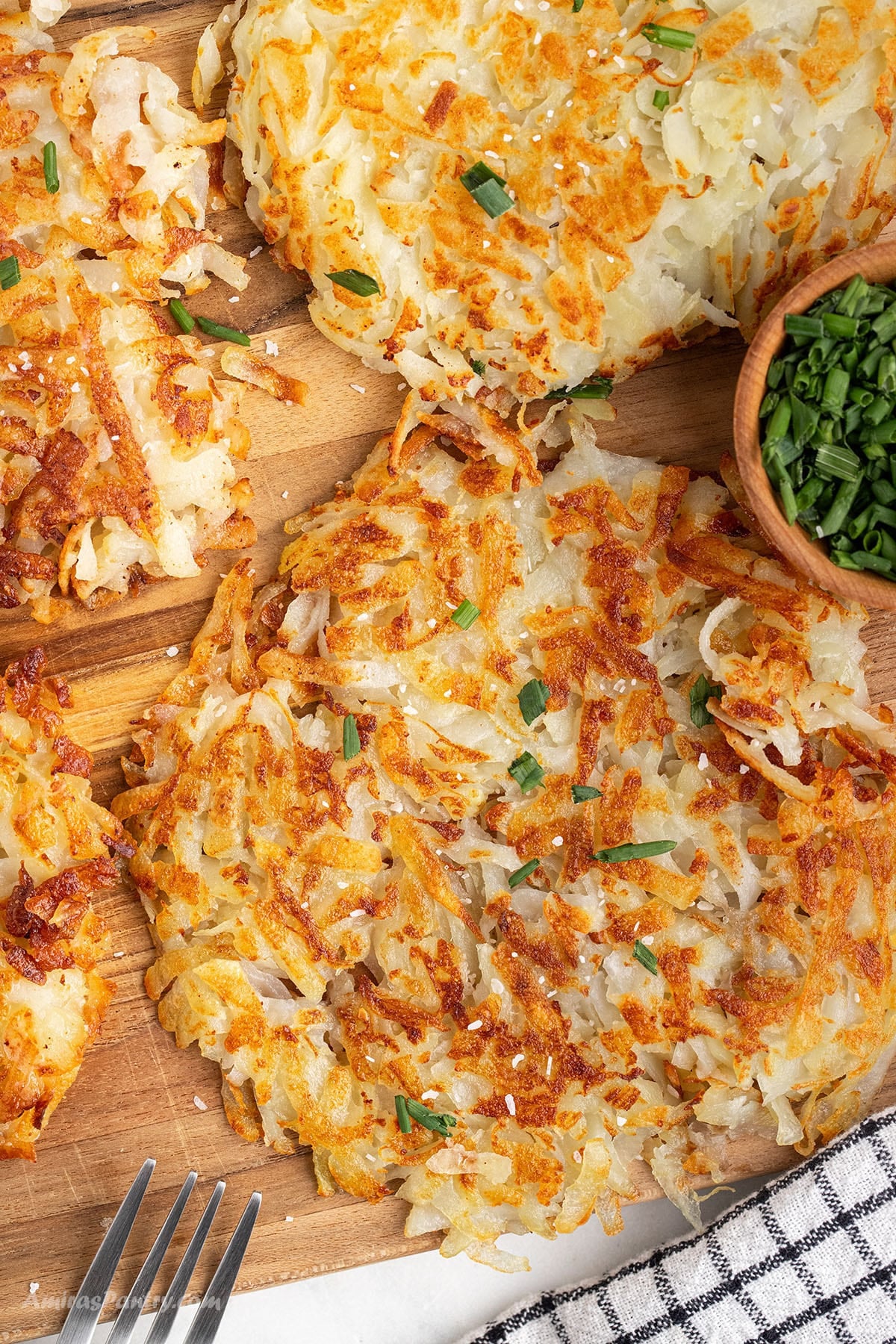 Potato rosti on a wooden board.
