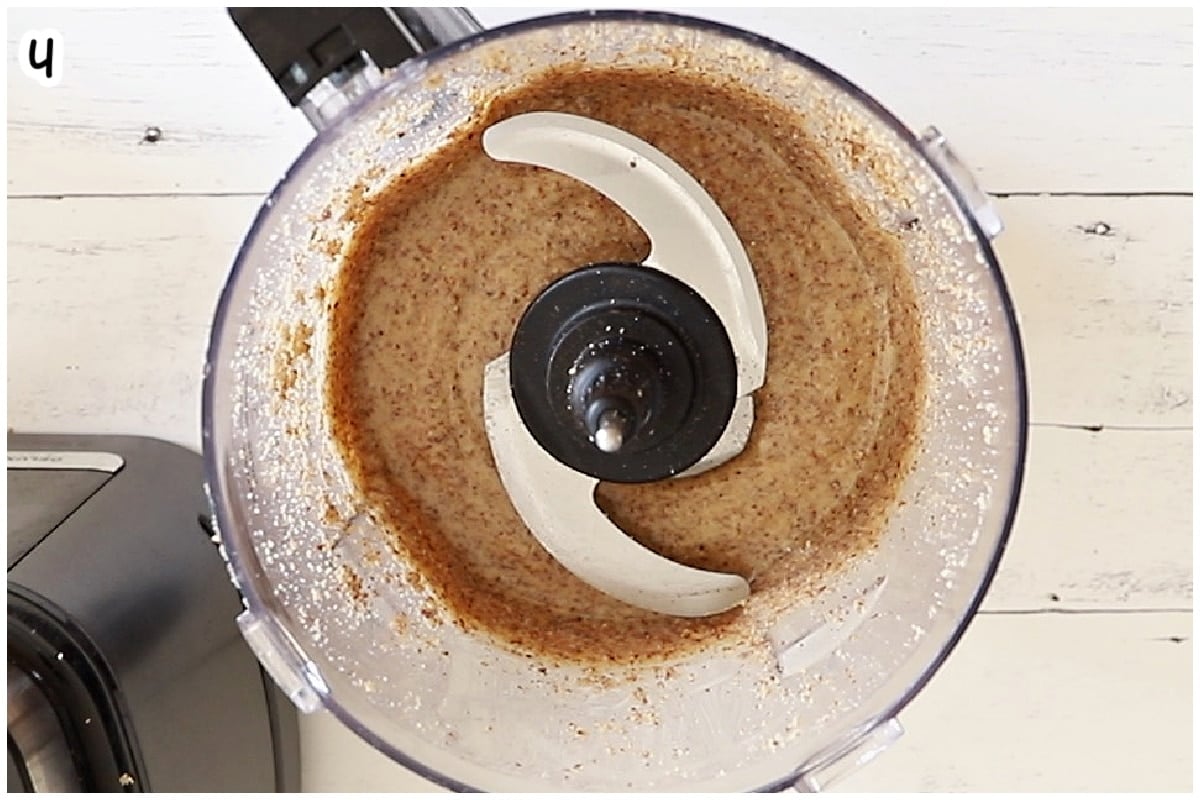 Smooth, creamy almond butter fully blended in a food processor.