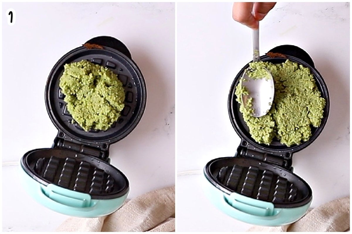 Falafel batter being spooned into and spread across an open mini waffle iron.