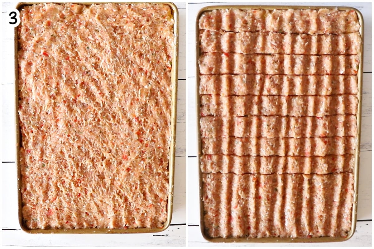 Seasoned ground chicken mixture spread flat on a sheet pan, then scored into kebab strips before baking.